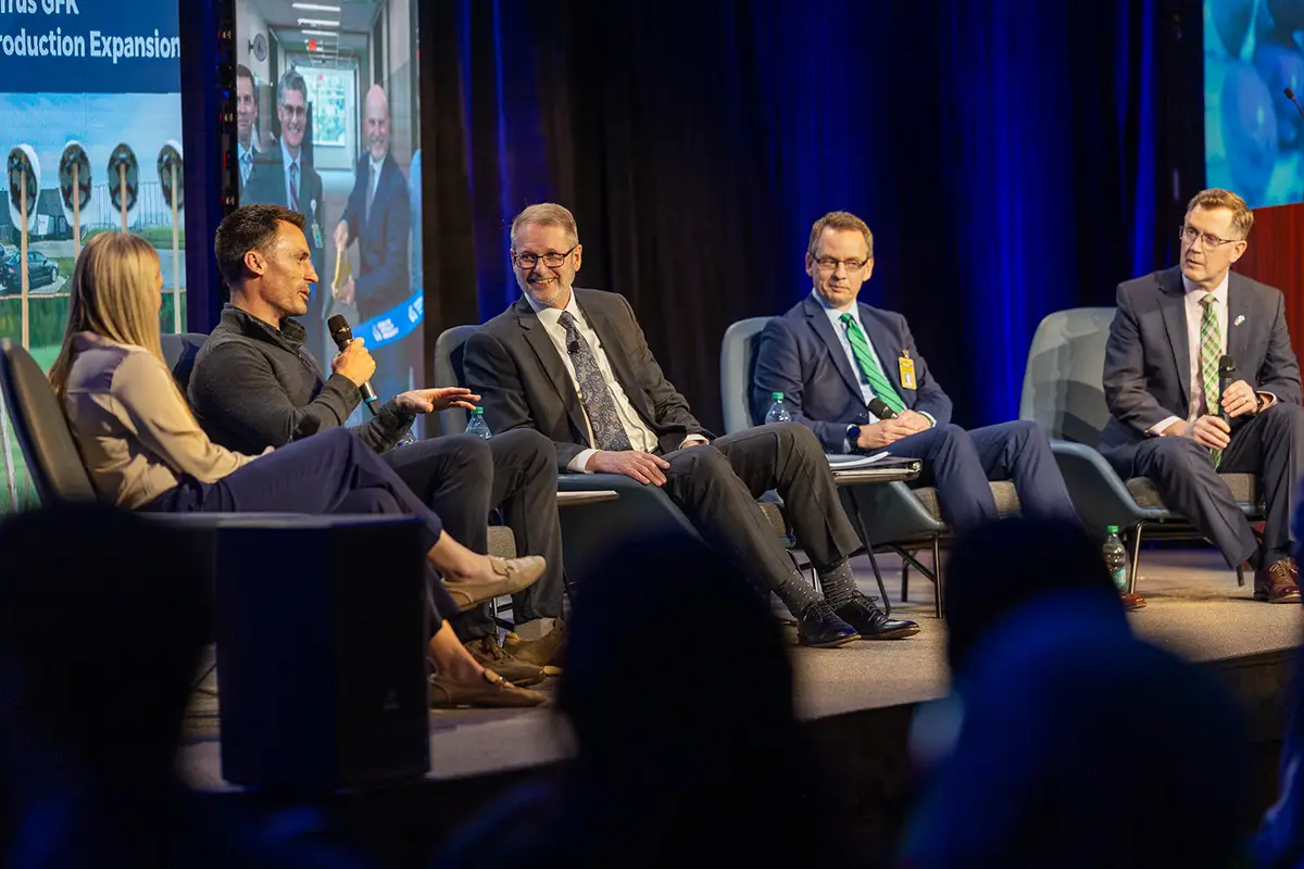 edc president & ceo keith lund sits on stage hosting a panel of grand forks regional leaders.