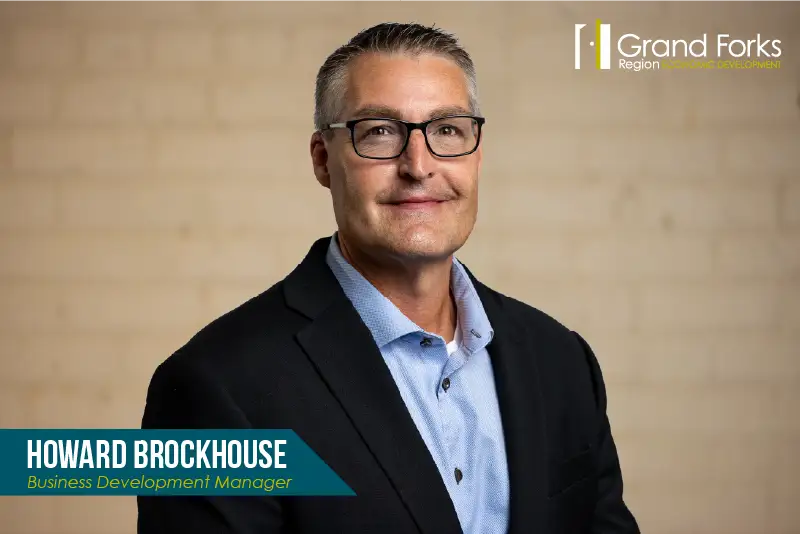 Headshot of Howard Brockhouse, Business Development Manager at Grand Forks Region Economic Development, wearing glasses and a dark blazer.
